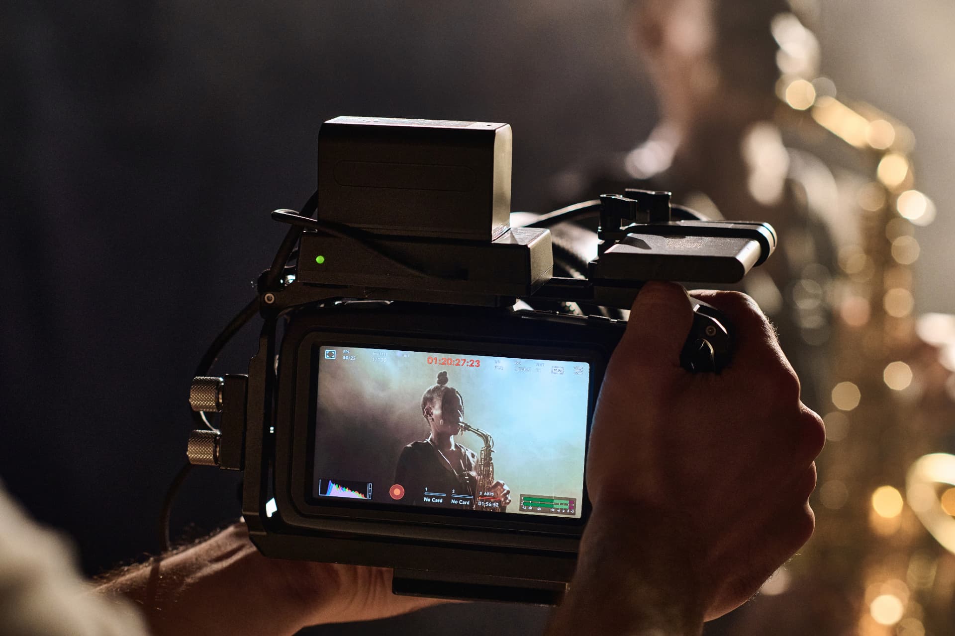 Camera filming a live musician